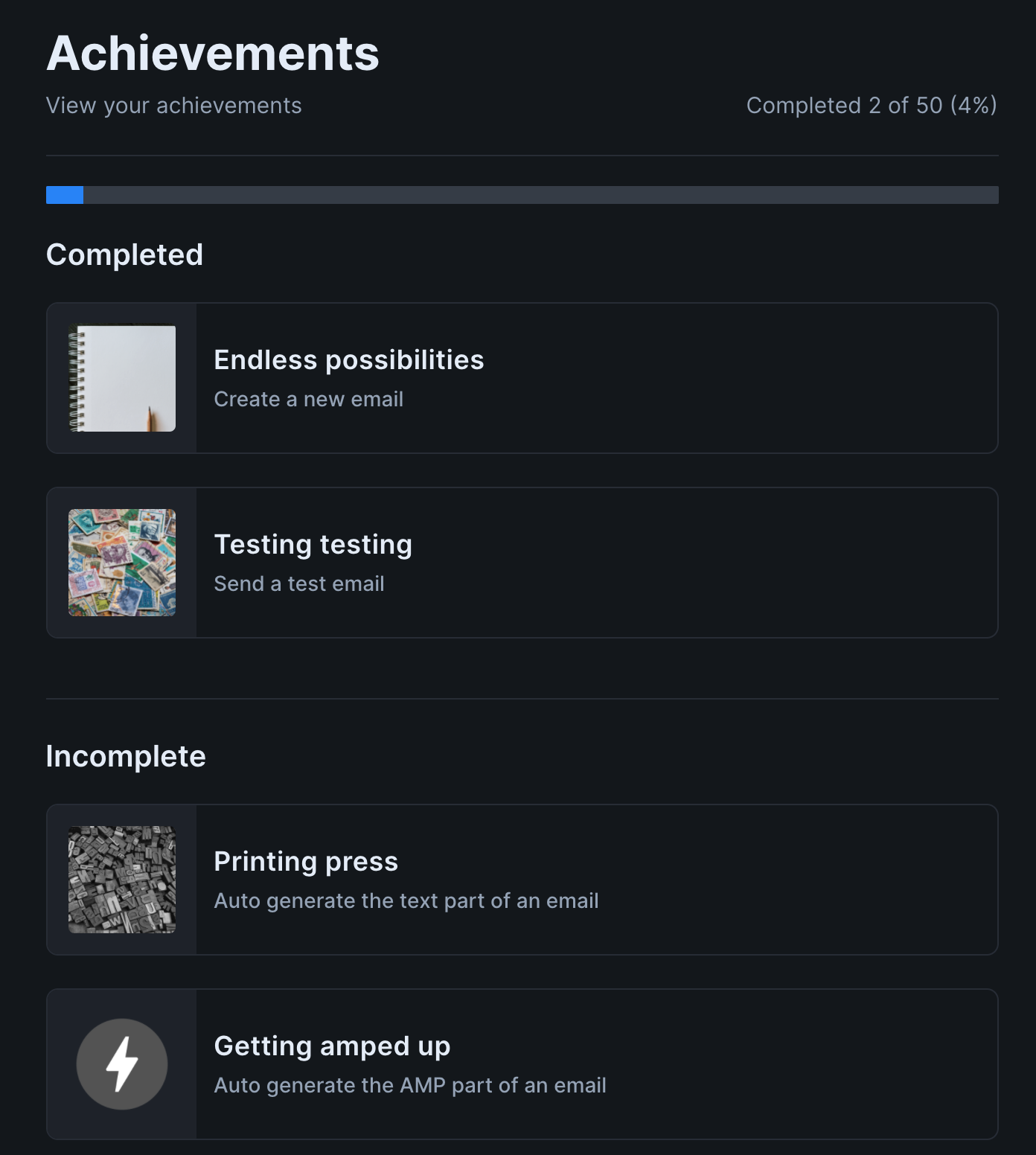 Image of a portion of the Achievements page. At the top is a partially completed progress bar and the text "Completed 2 of 50 (4%)". Below is a section titled "Completed", which contains two achievements. Each achievement has a title, description, and full color image. Below is a section titled "Incomplete", which contains two additional achievements. These achievements also have a title and description, but their image is grayscale.